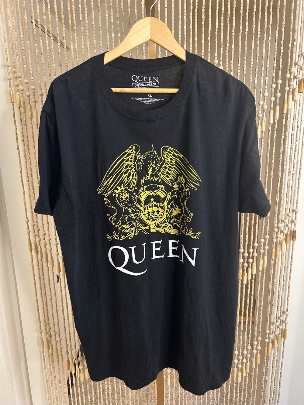 Queen Official Merch Black Short Sleeve Graphic Tee with Yellow Crest